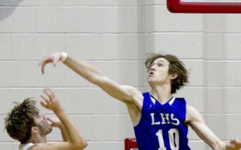 Kaeden Crawford (10) bats down a Bulldog two-point attempt. JEFF LOWE | DISPATCH RECORD
