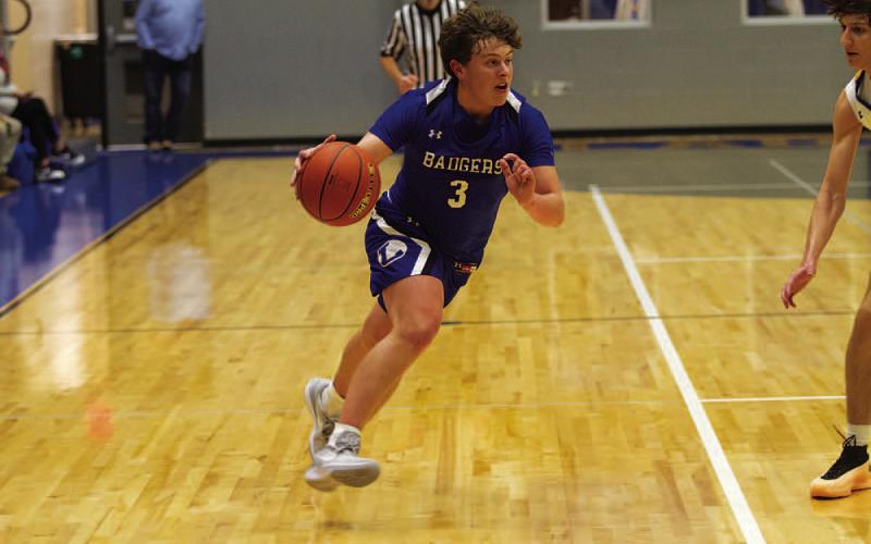 Aidan Nuckles drives past the defender during the first half on the road Tuesday. HUNTER KING | DISPATCH RECORD