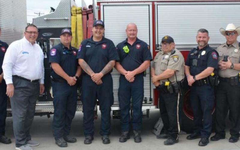 Members of the Hill Country 100 Club and Lampasas first responders gathered for this photo Monday. MONIQUE BRAND | DISPATCH RECORD