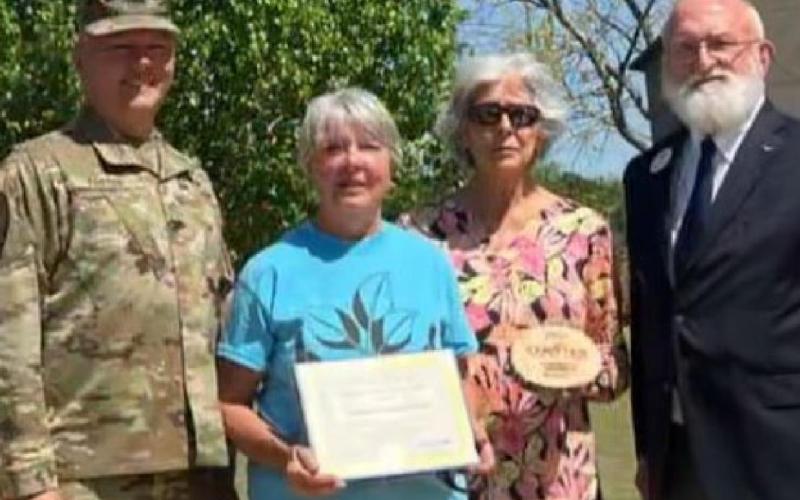 Janet Crozier from the Lampasas Community Garden, center, is pictured with, from left, Fort Hood Garrison Commander Col. Chad R. Foster, Lampasas Mayor TJ Monroe and Harker Heights Mayor Spencer H. Smith. CENTEX SUSTAINABLE COMMUNITIES FACEBOOK PAGE