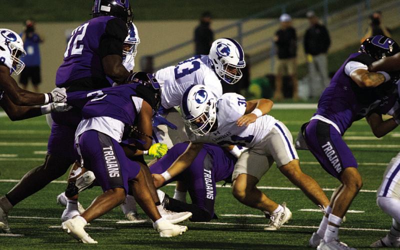 Tate Langford lowers his shoulders to make a tackle against Waco University. HUNTER KING | DISPATCH RECORD