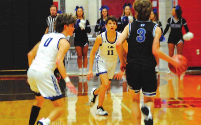Luke Shivers and Nate Borchardt, left, prepare to trap the Decatur ball handler last Friday night. HUNTER KING | DISPATCH RECORD