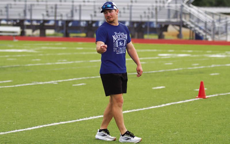 Case Brister leads a drill during SWAT on Tuesday morning at the high school. HUNTER KING | DISPATCH RECORD