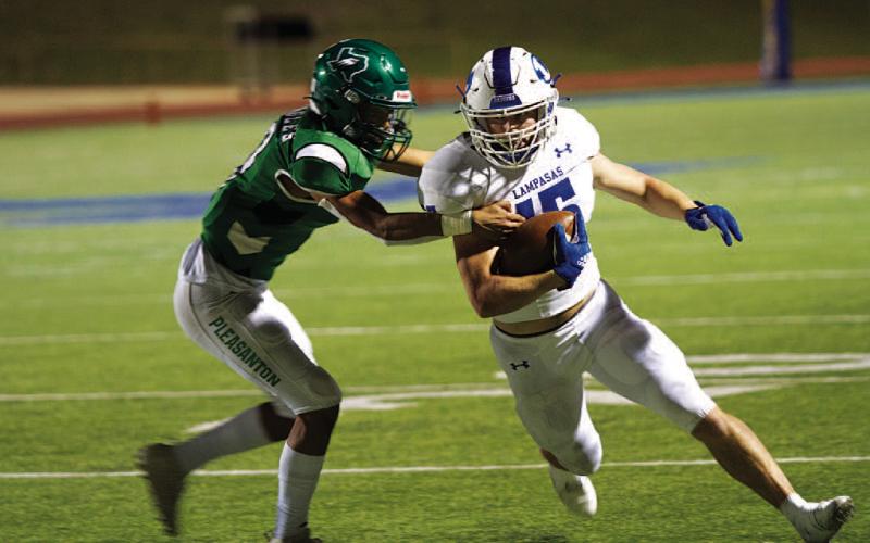 FILE PHOTO Brister runs the ball against Pleasanton in the playoffs during his final game as a Badger.