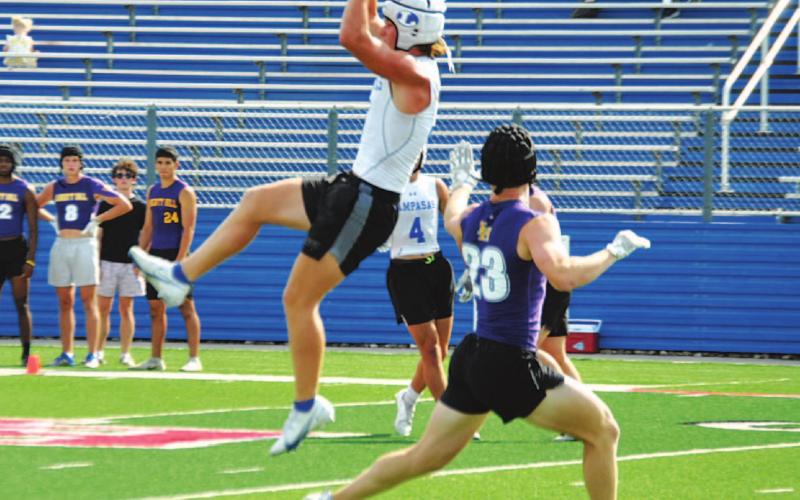Reed Jerome goes up over the middle of the field to make a catch against Liberty Hill. HUNTER KING | DISPATCH RECORD