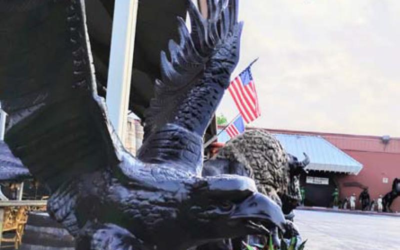 Extra American flags have been placed outdoors at Rustler’s Junction to honor the nation for its upcoming 250th birthday. The eagle -- a symbol of the country’s strength, freedom and independence -- can be seen in the foreground. courtesy photo