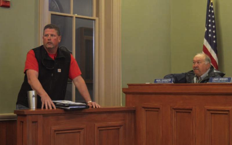 At left, John Stokes of All Seaons Service Inc. provides the Commissioners Court with an update regarding repairs to the HVAC systems in the county annex building at 407 S. Pecan St. ERICK MITCHELL | DISPATCH RECORD