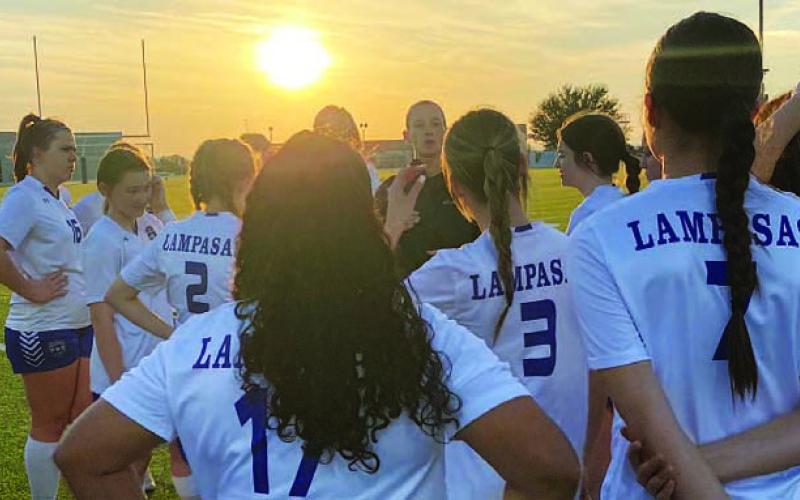 Head coach Emma Sharp talks to her team after their match against Marble Falls. COURTESY PHOTO