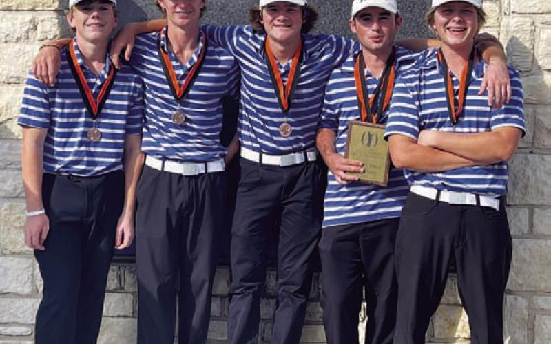 COURTESY PHOTO The Badger golf team poses with their medals and plaque.