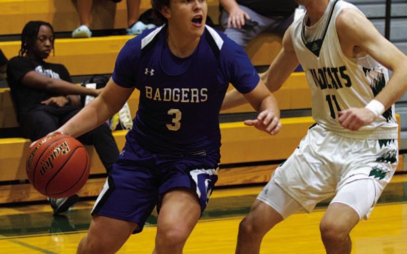 Aidan Nuckles dribbles past a Scurry-Rosser defender in last Thursday’s game. HUNTER KING | DISPATCH RECORD