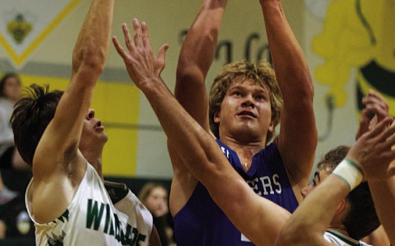 Haegan Oncken shoots over a couple of opponents. HUNTER KING | DISPATCH RECORD