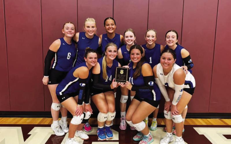 The volleyball team poses with their plaque from the Killeen tournament last weekend. COURTESY PHOTO | LAMPASAS ATHLETICS
