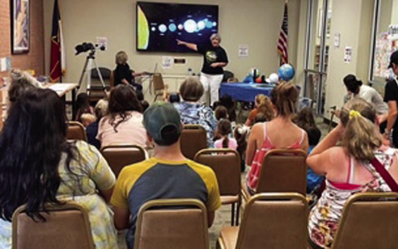 Lampasas County Friends of the Night Sky was a part of the Lampasas Public Library’s Summer Reading Program for kids ages 3-10. Here, Dianna Hodges discusses the 2024 Solar Eclipse with the group. COURTESY PHOTO | FRIENDS OF THE NIGHT SKY
