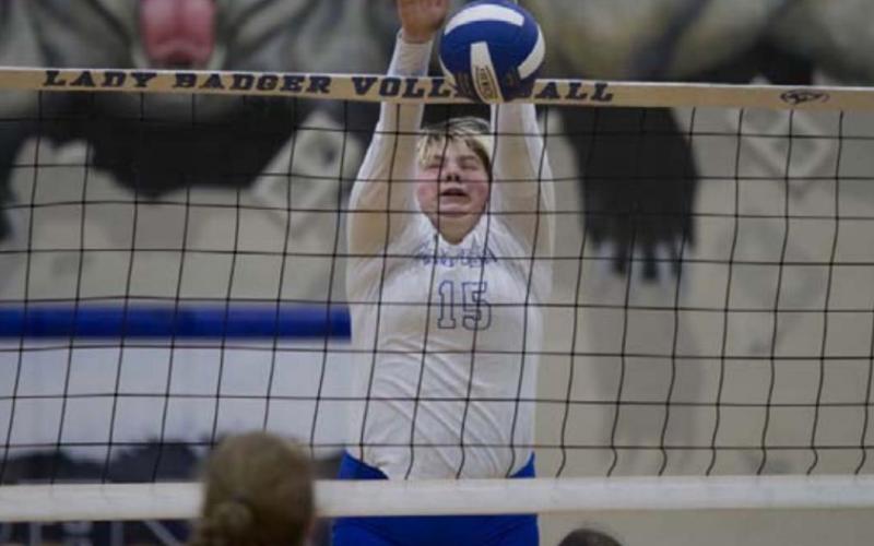 Morgan Lovejoy blocks an attempted Brownwood kill during Tuesday’s match. HUNTER KING | DISPATCH RECORD