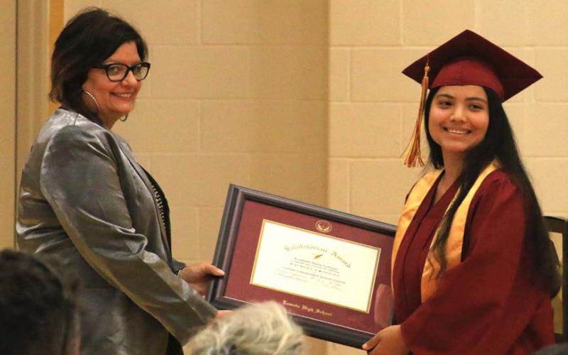 Salutatorian Elizabeth Carbajal, at right, receives her award certificate from Lometa Principal Amanda Morris. MASON HINES | DISPATCH RECORD