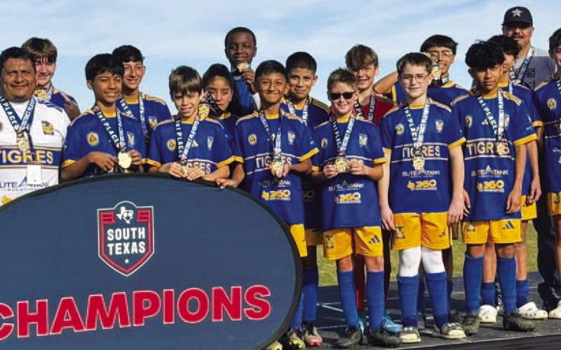 COURTESY PHOTO | MIGUEL ACOSTA The Lampasas Tigres pose with their championship medals after winning in San Antonio.