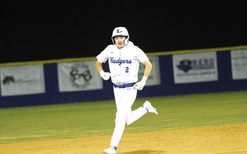 Cory White screams in celebration after rounding second base following his walk-off home run. HUNTER KING | DISPATCH RECORD