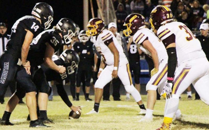 Adrian Smailus-Cruz, right, D.J. Smart and Elijah Gonzalez prepare to rush against Water Valley last Friday. JESSICA MALDONADO | DISPATCH RECORD
