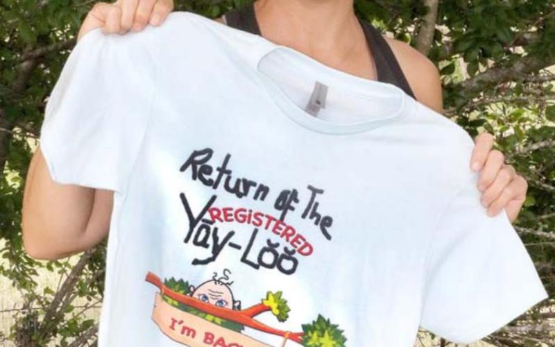 Amy Vann holds the first run of a new limited-version “Yay-Loo” T-shirt, designed by her mother, Patsy Stoneham. Updated versions of the shirt are available now at Merk &amp;amp; Tilley’s. PATSY STONEHAM | COURTESY PHOTO