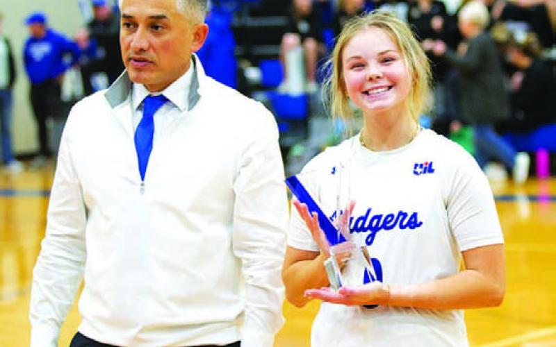 Addison Borchardt, with head coach Marcus Chapa, was named the Greater Texas Ford 4A Female Athlete of the Month. She received the award during halftime of the boys’ basketball game last Friday night. HUNTER KING | DISPATCH RECORD