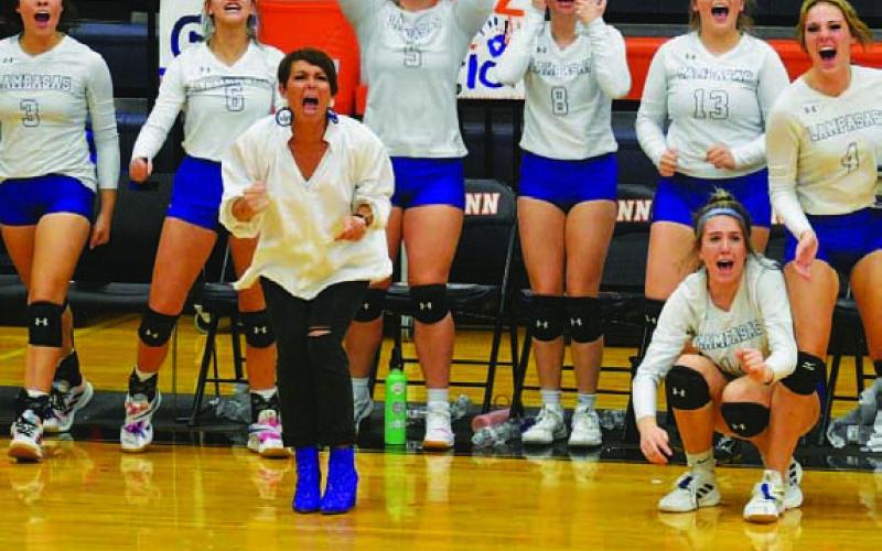 COURTESY PHOTO Head coach Christy Wiley and her team celebrate a big point.