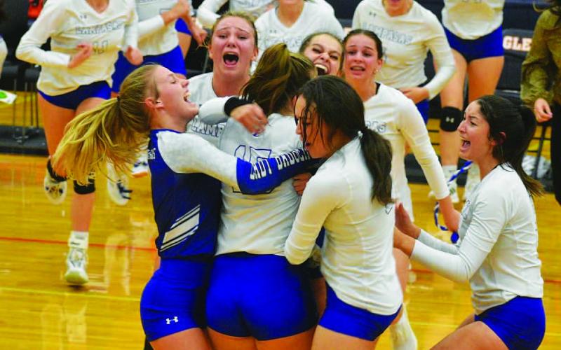 COURTESY PHOTO The Lady Badgers show their excitement after qualifying for the playoffs for the first time in 11 years.