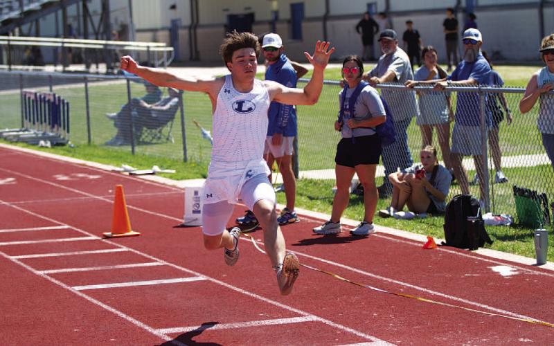 Jonathan Bowling leaps during the triple jump event last Thursday. HUNTER KING | DISPATCH RECORD