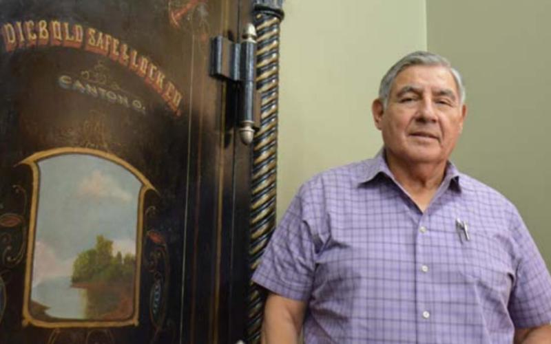 Longtime Precinct 1 Justice of the Peace Andrew Garcia Jr. stands by his office’s steel doorway, where he married many Lampsas County couples. MONIQUE BRAND | DISPATCH RECORD
