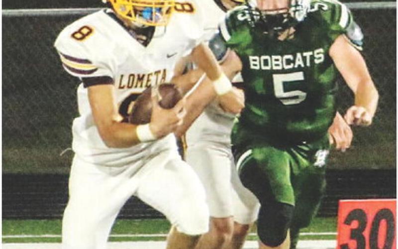COURTESY PHOTO | MEGAN LUSTY Brandon Moore looks for space to run the ball.
