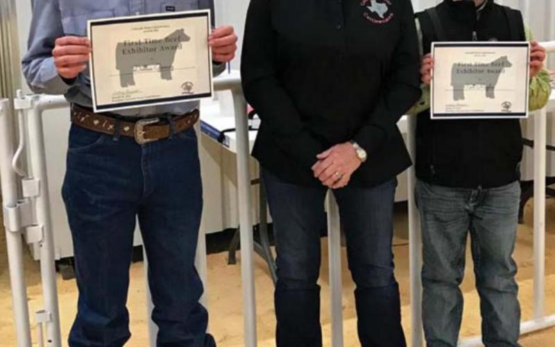 Lampasas County first-time beef exhibitors Dallas Gomez, at left, and Cort Maples are pictured with Janet Machen, Colorado River CattleWomen vice president. COURTESY PHOTO