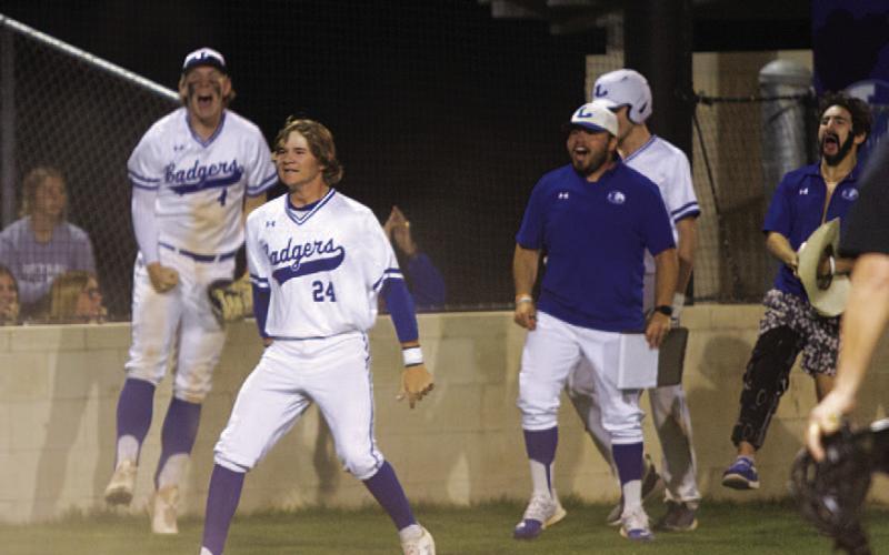 HUNTER KING | DISPATCH RECORD Timber Gholson and the rest of the team jump and celebrate after Rascoe’s home run that gave Lampasas the lead.