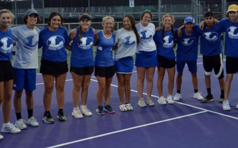 The Badger tennis team poses for a group photo after winning the first district match, which was in Stephenville on Friday. HUNTER KING | DISPATCH RECORD