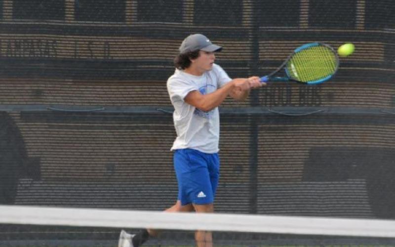 Elias Arellano swings on a forehand shot during his match against Stephenville at Tarleton State University on Friday. HUNTER KING | DISPATCH RECORD
