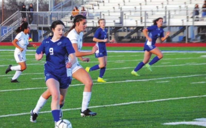 Bella Lindsey dribbles past Jarrell defenders during a previous game for the Lady Badgers. HUNTER KING | DISPATCH RECORD
