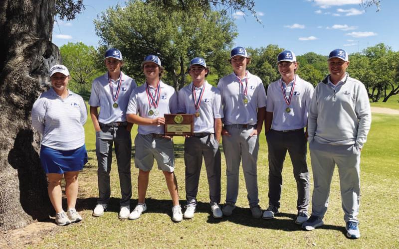 The boys’ golf team poses with their first-place medals and plaque from the district golf tournament. COURTESY PHOTO | GERRY SPORE