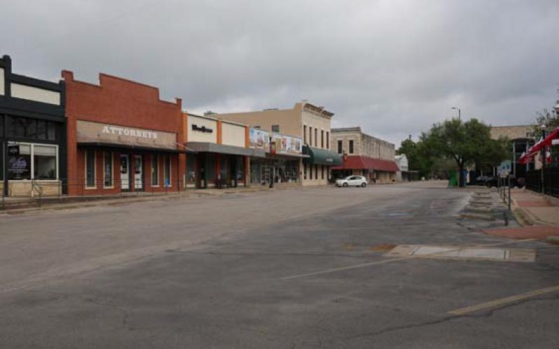 April 8 opened on the Lampasas courthouse square with an eerie stillness. Very few cars were on the streets, and only a few were parked after carrying passengers to conduct business downtown. Crowds arrived on the square later Monday morning, however, to view the totality offered by the total eclipse. JOYCESARAH MCCABE | DISPATCH RECORD