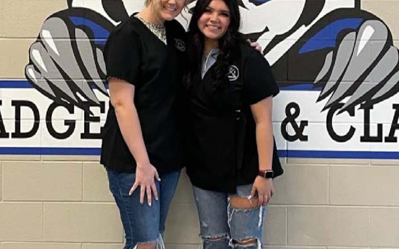 Megan Caddies, left, and Bella Guerra are now licensed cosmetologists after passing their state exams. COURTESY PHOTO