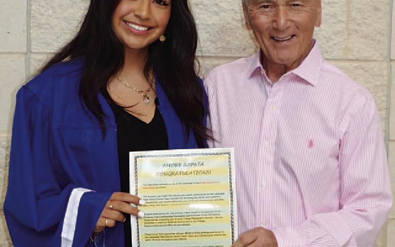 Amore Zapata, left, and Phil King pose with the scholarship. COURTESY PHOTO | KENNETH PEISER