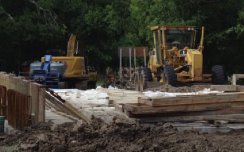 Reconstruction of the bridge on East Third Street continued through the summer. FILE PHOTO