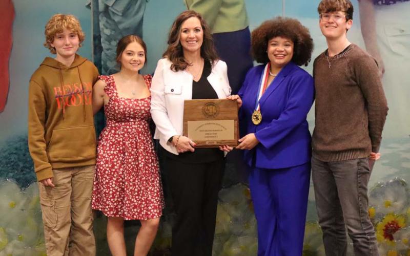 Speech and Debate team members brought home the third-place overall team title. From left to right are Liberty Potts, Jewel Groves, coach Cheri Wienecke, Sholee Turner and Wyatt Potts. Turner also was named the state champion in poetry. courtesy photo
