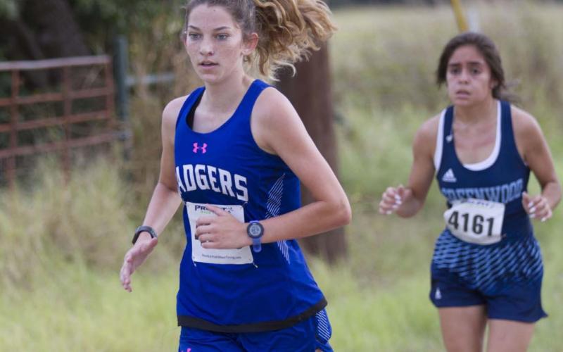 Nyla Long runs down the trail during the Badgers