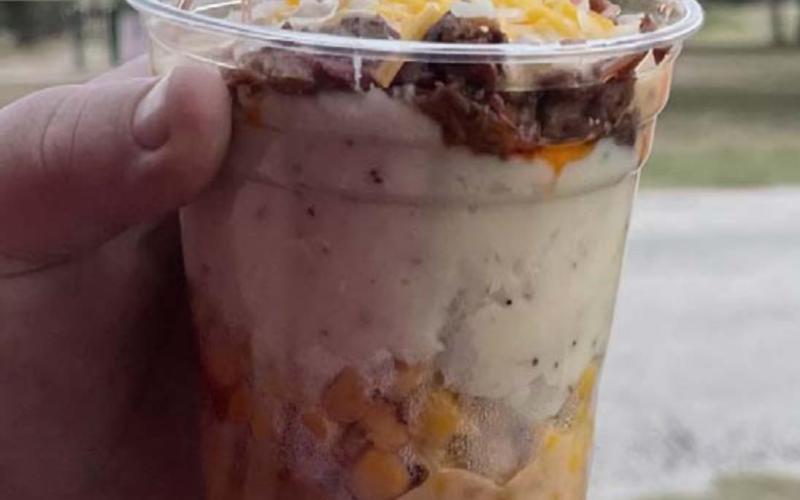 The concession stand served “Cowboy Sundaes,” a brisket treat with queso, mashed potatoes and corn. MASON HINES | DISPATCH RECORD