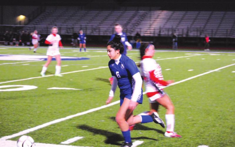 Kailyn Cisneros dribbles past a Salado Lady Eagle player in last week’s contest. HUNTER KING | DISPATCH RECORD