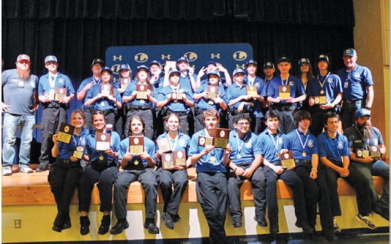LHS law enforcement, firefighting, and EMT teams pose for a photo with awards after the regional meet on Dec. 6. COURTESY PHOTO