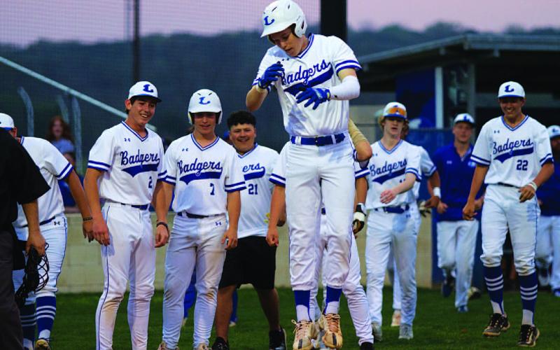Jonas Andersen hops onto home plate after launching a two-run home run to open the scoring in last week’s game. HUNTER KING | DISPATCH RECORD