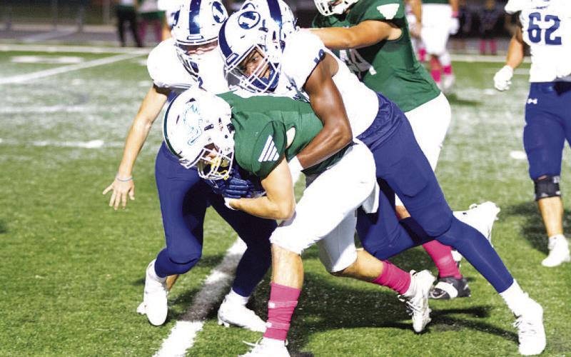 Trenton Hobbs brings down the ball carrier in the second half of last Friday’s game. HUNTER KING | DISPATCH RECORD