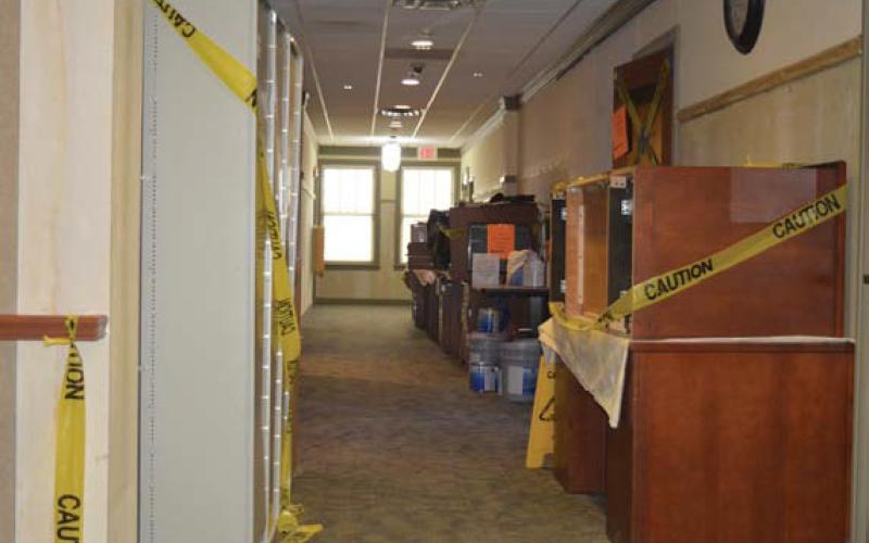 Furniture and supplies from the Lampasas County Auditor’s Office rest in the hallway as renovations and repairs continue. erick mitchell | dispatch record