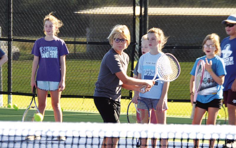 FILE PHOTO Jack Allison trains his backhand during tennis camp last May.