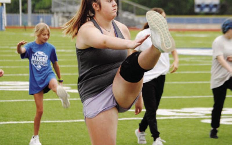 Abigail Williams warms up before a workout at last year’s SWAT. FILE PHOTO