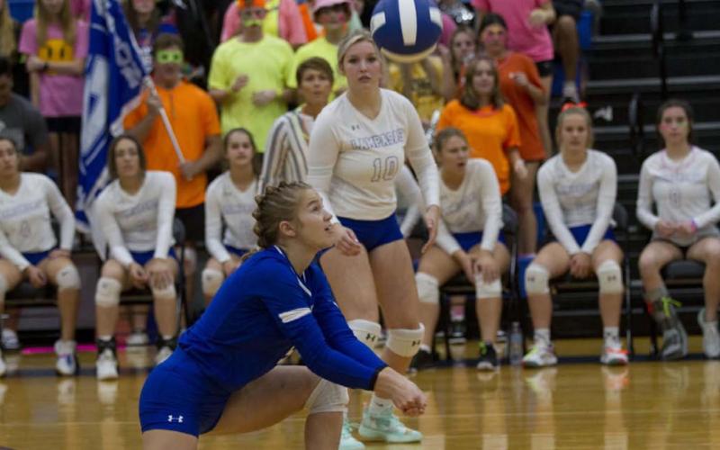 HUNTER KING | DISPATCH RECORD Hadley Oncken picks up a dig during the Lady Badgers’ match against Gatesville on Tuesday.